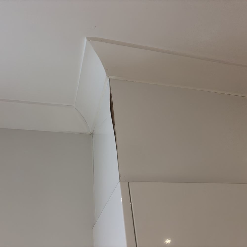 Wide cracking through internal plaster, investigated for its cause, found during a defect investigation inspection in South Kingsville
