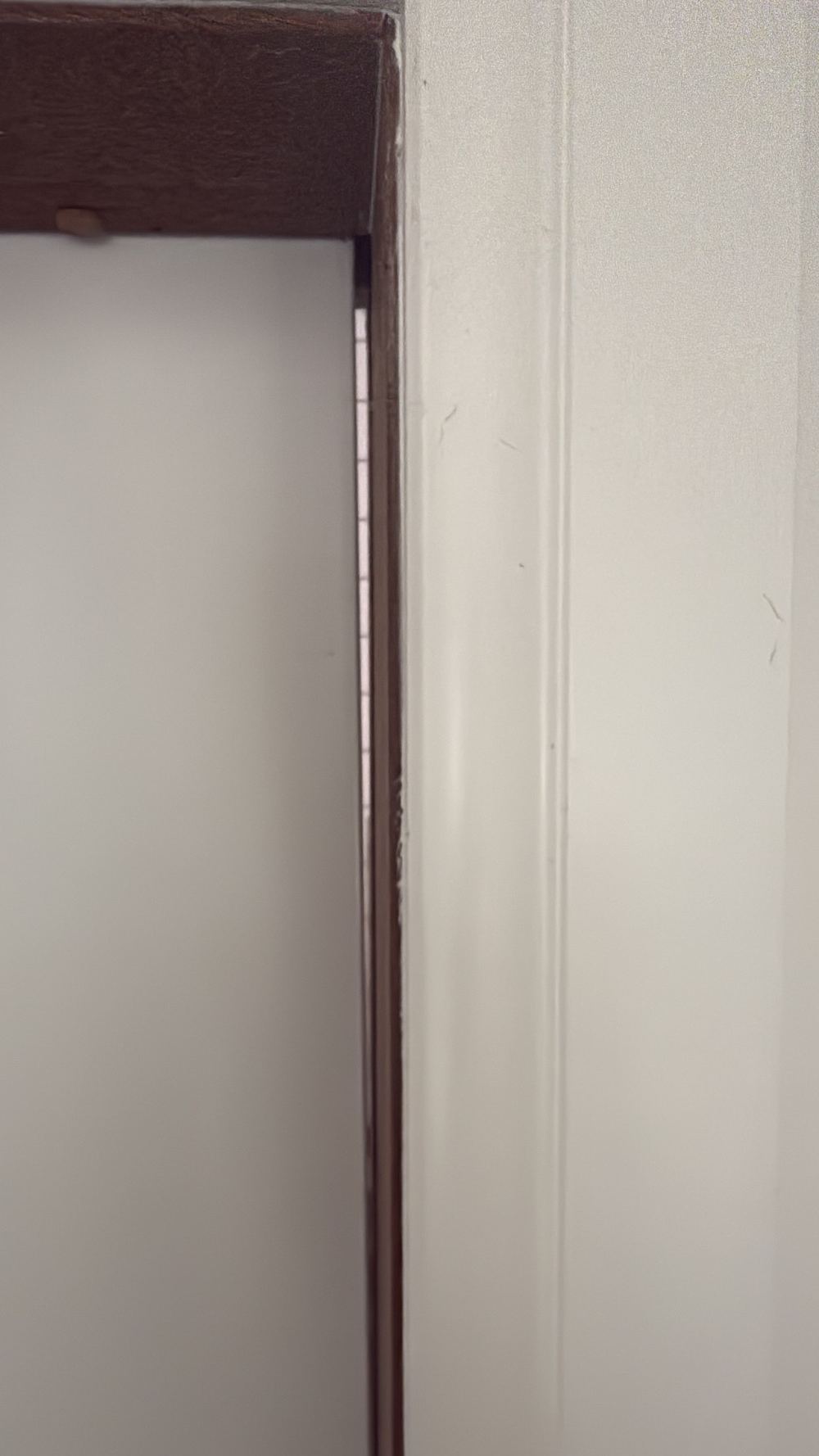 Door jamb bowed out of line, found during a defect investigation inspection in Seddon