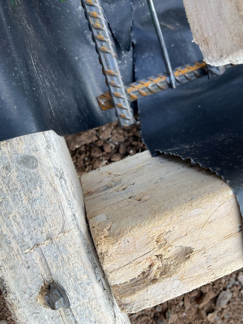 Vapour barrier stopping short of the edge beams instead of running to ground level, Manor Lakes