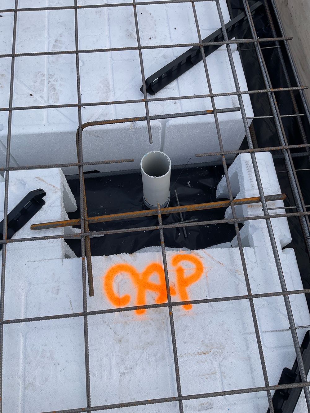 Drainage pipes left open, so rubble can fall in before the pour, found during a slab pre-pour inspection in Manor Lakes